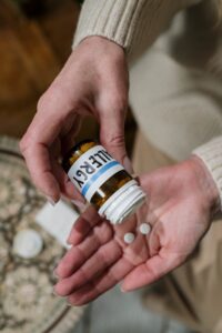 Allergy medication pills on hands